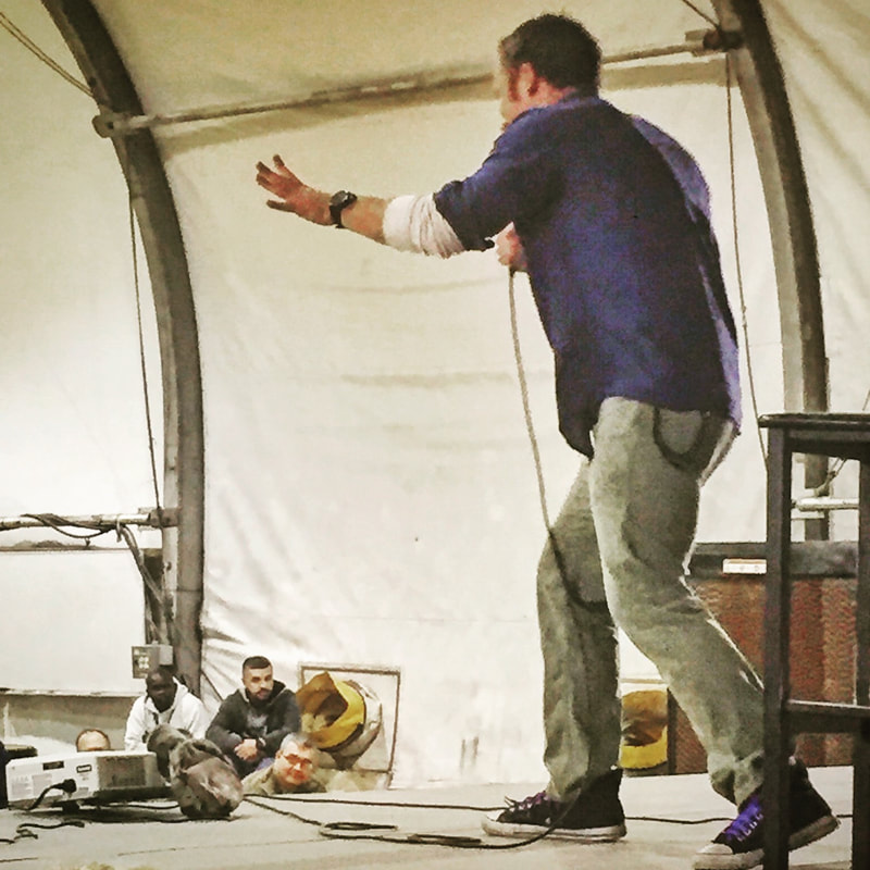Joel Bryant, standup comedy at Bagram Air Base in Afghanistan on military standup comedy tour for Armed Forces Entertainment