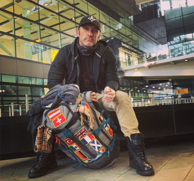 Joel Bryant backpacking through Europe, here at Heathrow Airport in London, England