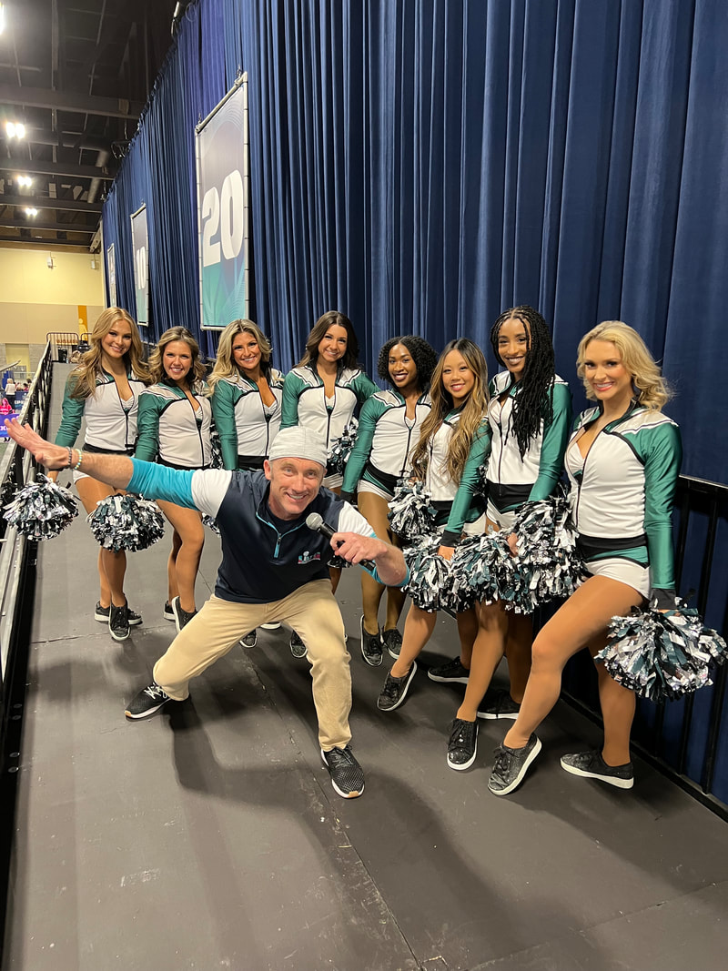Posing with the Philadelphia Eagles cheerleaders at the Super Bowl Experience at Super Bowl 57 in Glendale Arizona